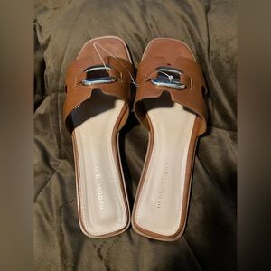 Madden Girl brand, size 10, brown slip on, flat sandals, new without tags